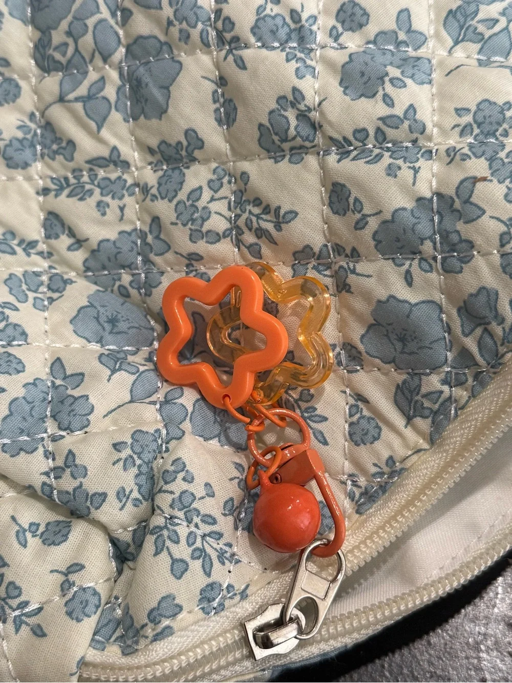 Quilted Floral Cosmetic Pouch in Light Blue and Cream with Orange Bag Charm